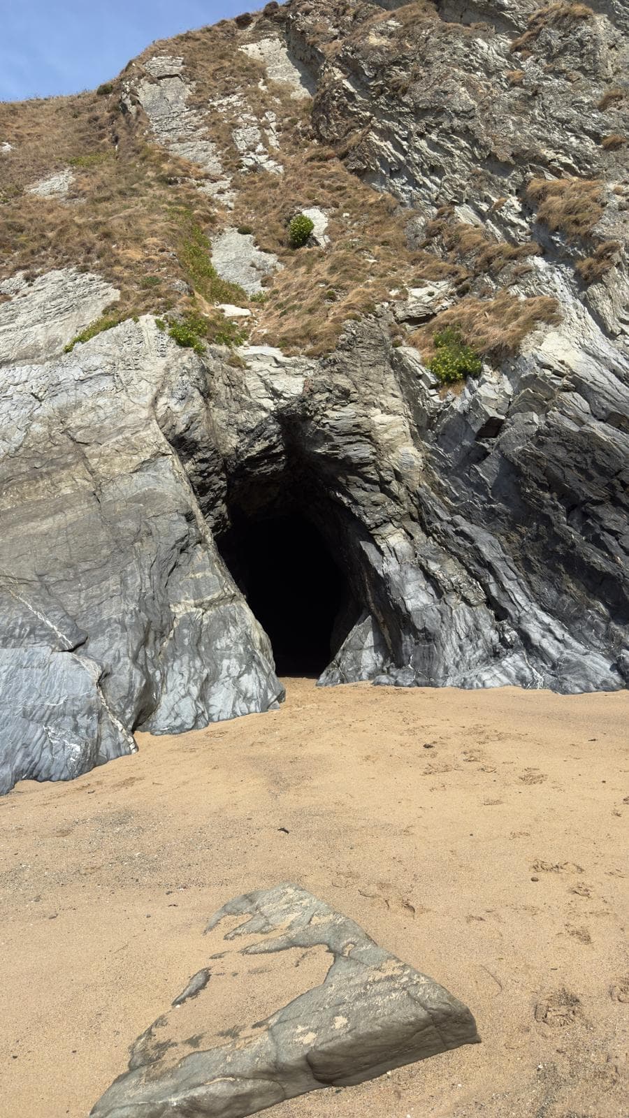 Walking through the Smugglers' Cave passage between beaches